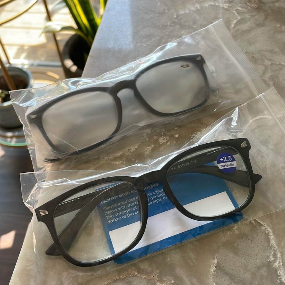 Two pairs readers 2.5 & 2.0 blue light combination readers both solid black